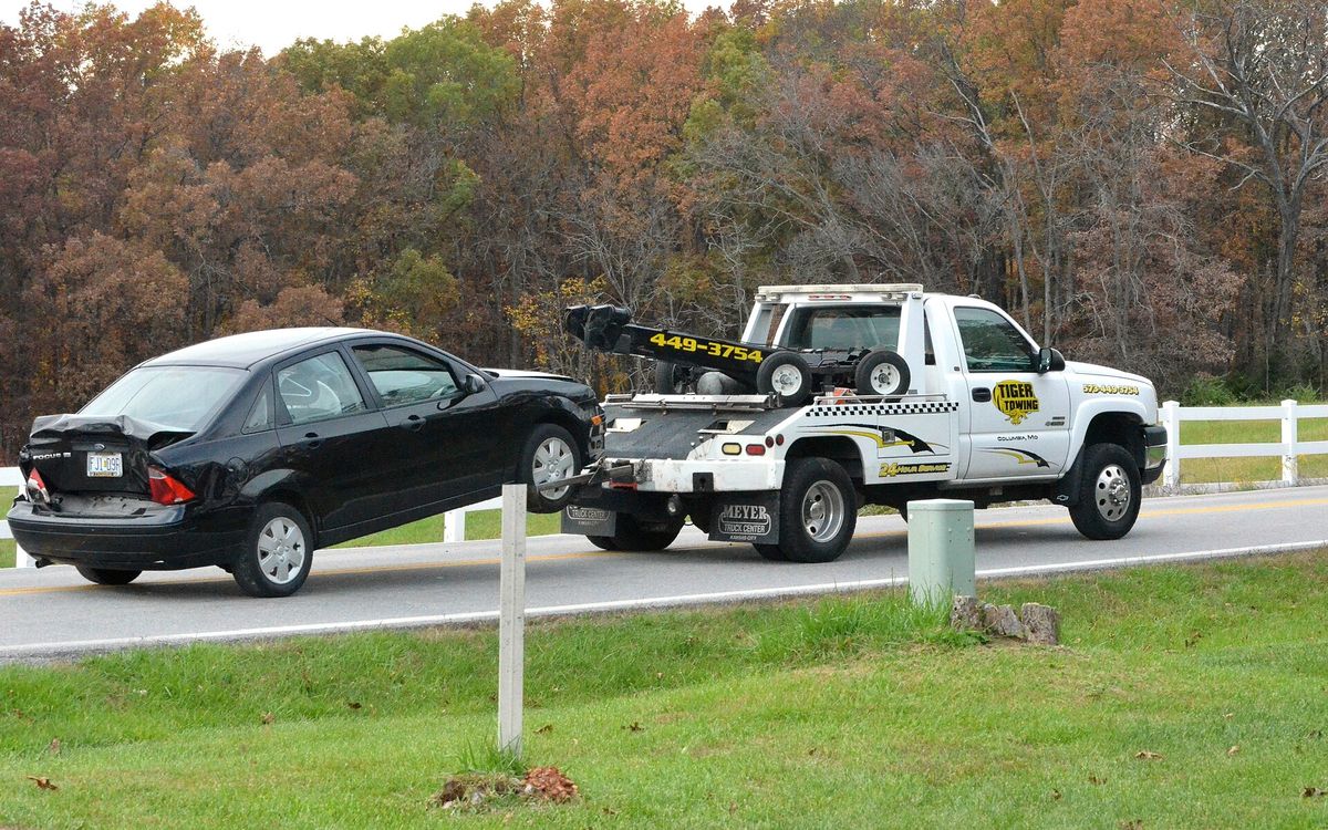 Tow truck recovering a car on the roadside